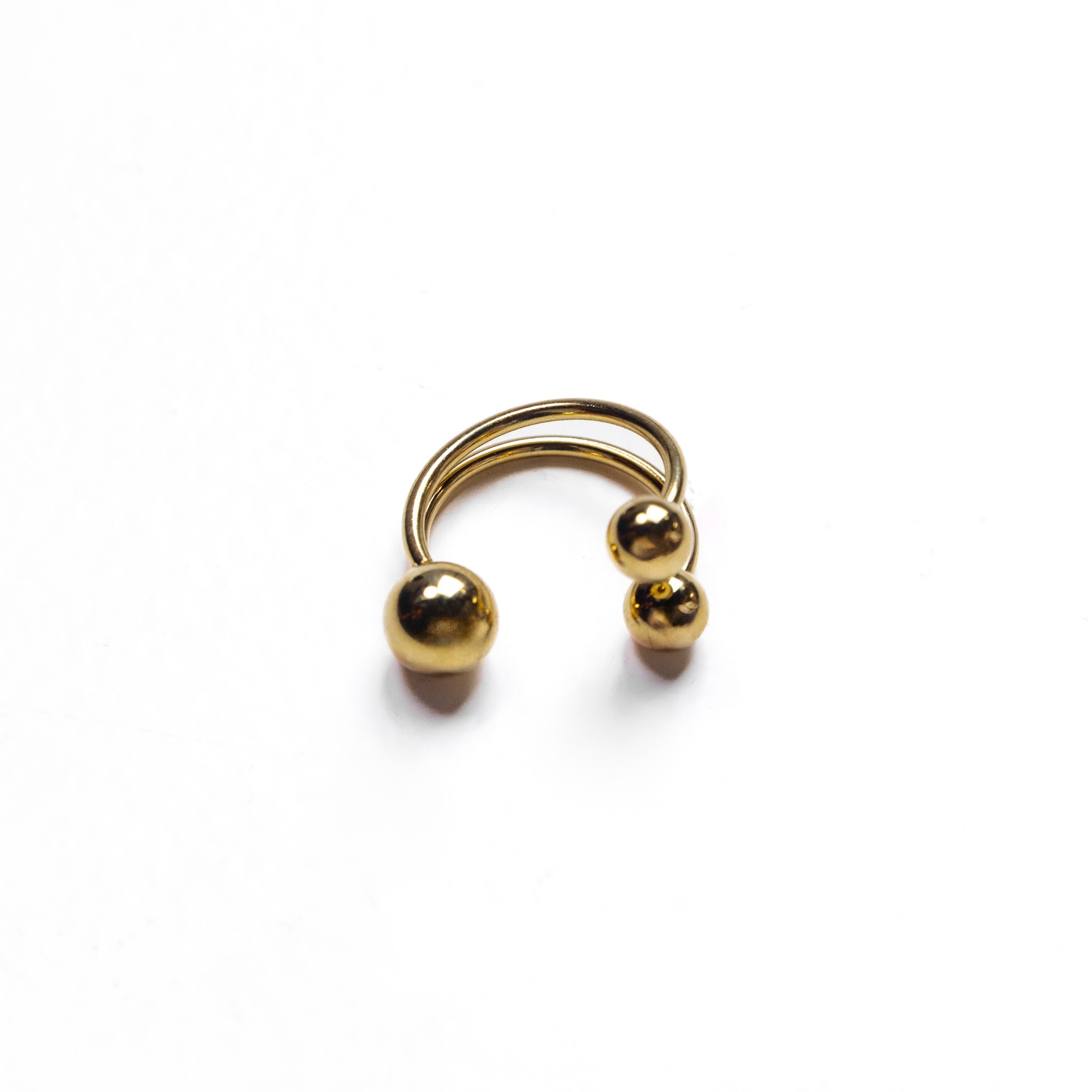 Gold open-band ring featuring three polished spheres.